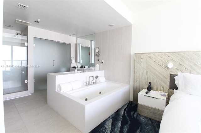 bathroom with vanity, tile walls, shower with separate bathtub, and tile patterned flooring