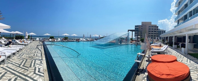 view of pool featuring a water view