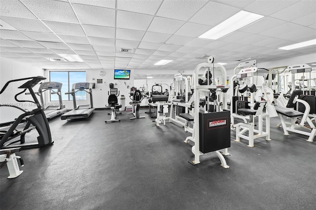 gym featuring a drop ceiling