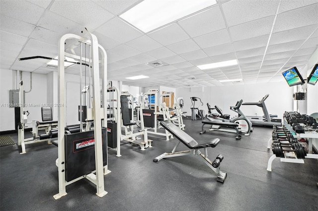 workout area featuring a paneled ceiling