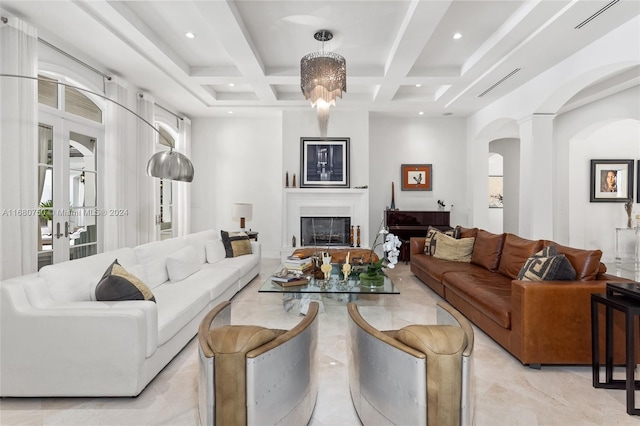 living room featuring french doors, beam ceiling, and coffered ceiling