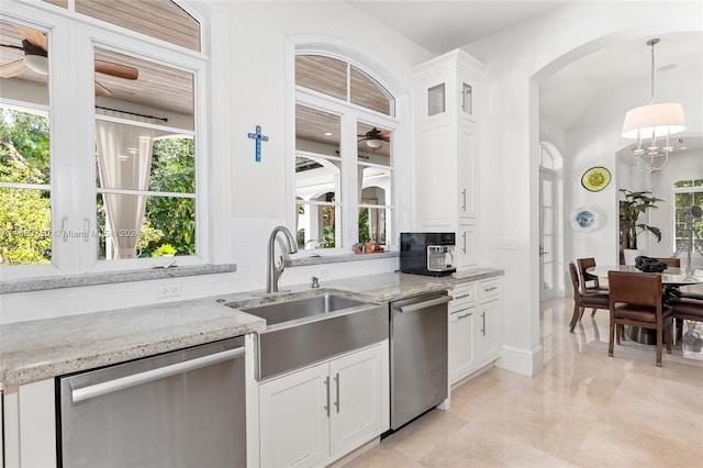 kitchen with stainless steel dishwasher and white cabinets