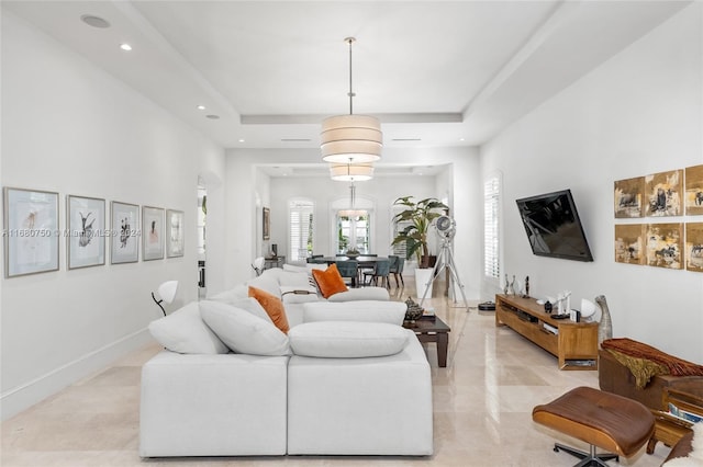 living room with a raised ceiling