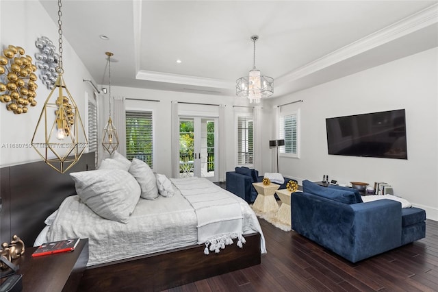 bedroom with access to outside, a tray ceiling, dark hardwood / wood-style flooring, crown molding, and a notable chandelier