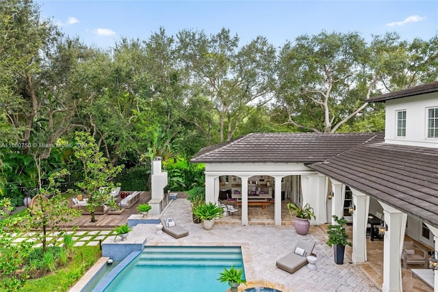 view of pool featuring a patio area