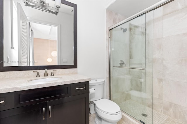 bathroom with vanity, toilet, and walk in shower