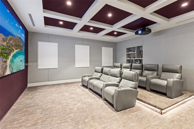 carpeted home theater room featuring beam ceiling and coffered ceiling