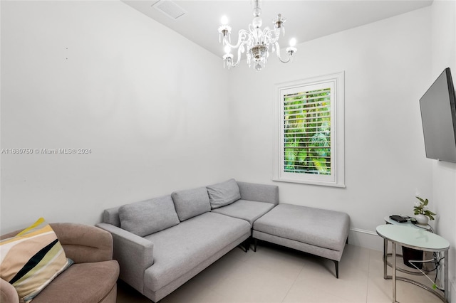 living room featuring an inviting chandelier and light tile patterned floors