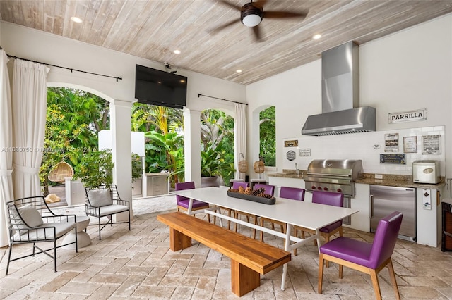 exterior space with sink, wood ceiling, and ceiling fan