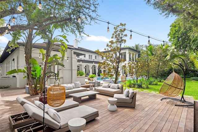 wooden terrace featuring outdoor lounge area