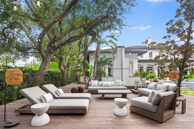 view of patio featuring outdoor lounge area and a wooden deck