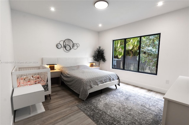 bedroom featuring dark hardwood / wood-style floors