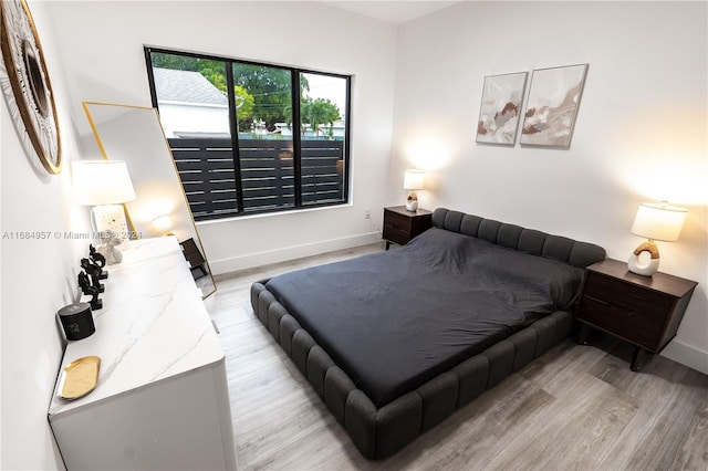 bedroom with light hardwood / wood-style floors