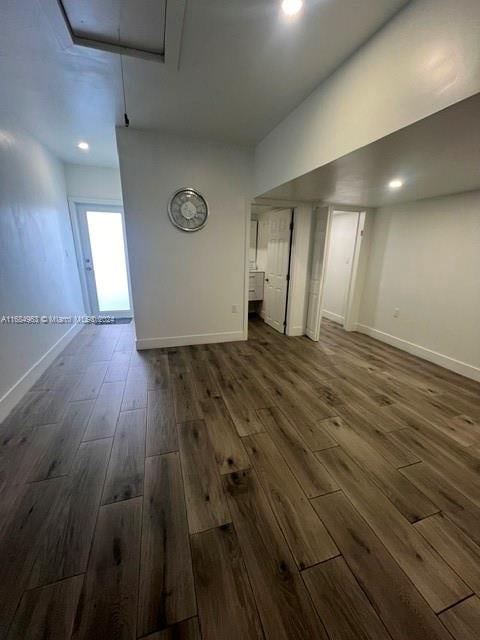 unfurnished room with dark hardwood / wood-style floors