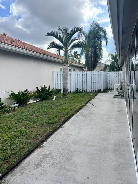 view of home's exterior featuring a yard