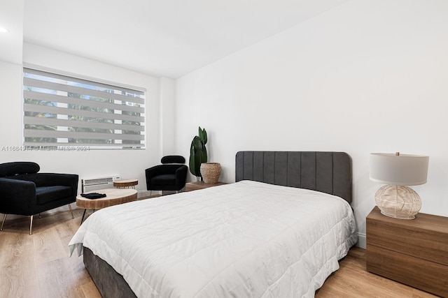 bedroom with light hardwood / wood-style floors