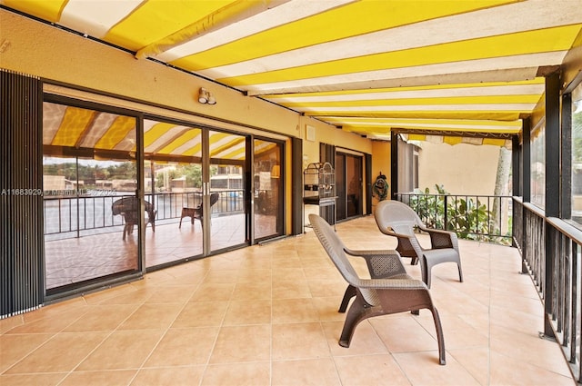 sunroom / solarium with beamed ceiling