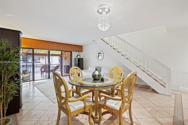 dining room with wooden walls and light tile patterned floors