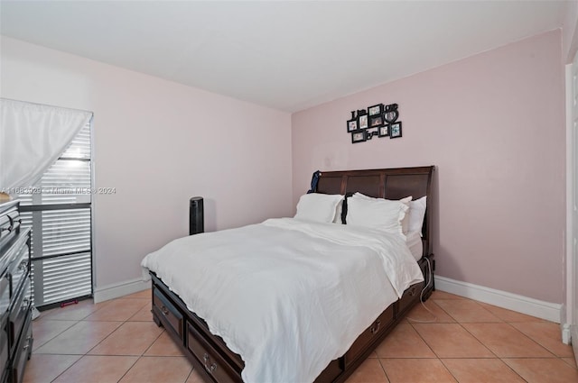 bedroom with light tile patterned floors