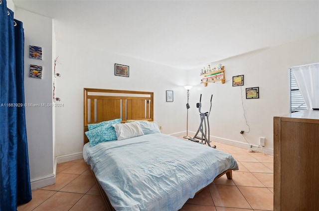 bedroom featuring light tile patterned floors