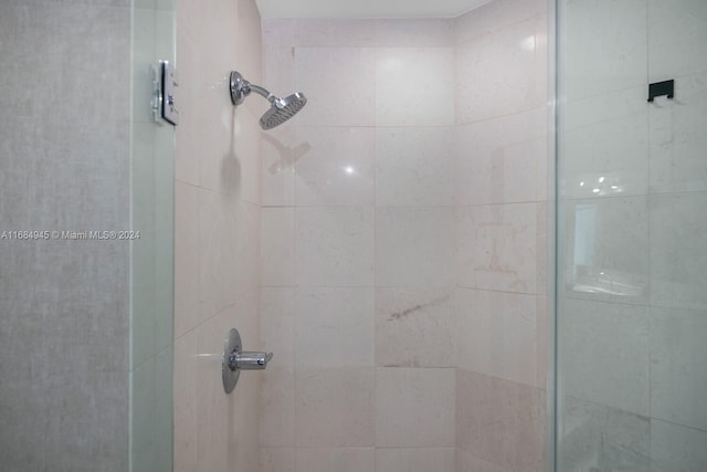 bathroom with a tile shower