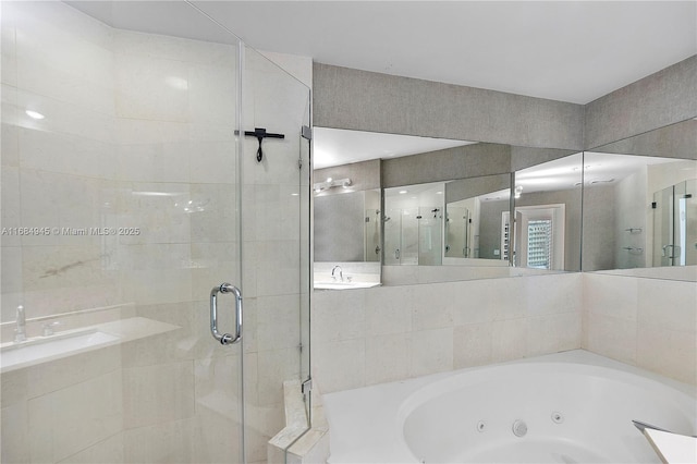 bathroom featuring a stall shower and a jetted tub