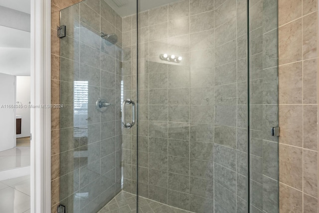 bathroom featuring a shower with shower door