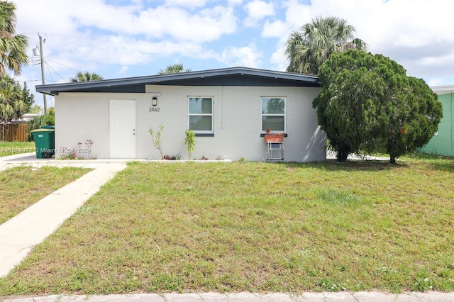 view of front of home with a front lawn