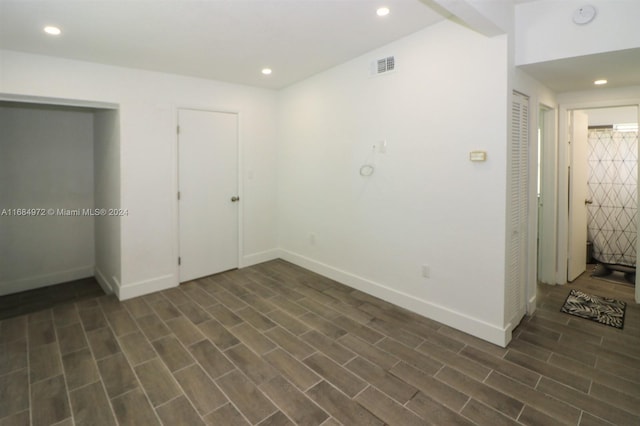 unfurnished bedroom featuring dark hardwood / wood-style flooring