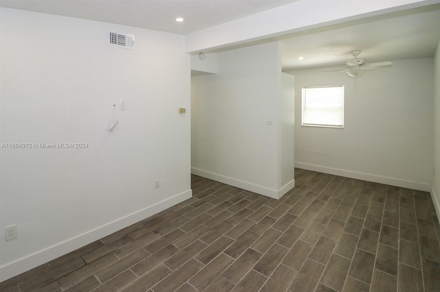 unfurnished room featuring ceiling fan and dark hardwood / wood-style floors