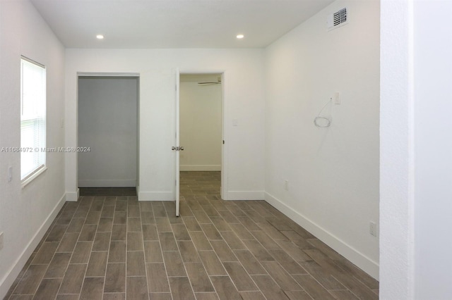 unfurnished bedroom featuring dark hardwood / wood-style floors