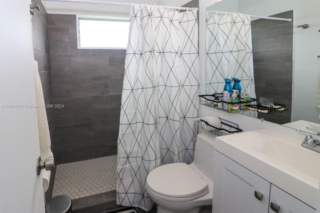 bathroom with vanity, toilet, and walk in shower