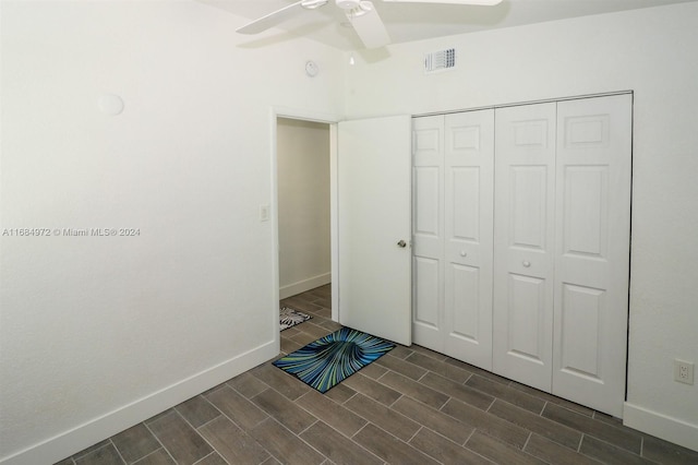 unfurnished bedroom featuring a closet and ceiling fan