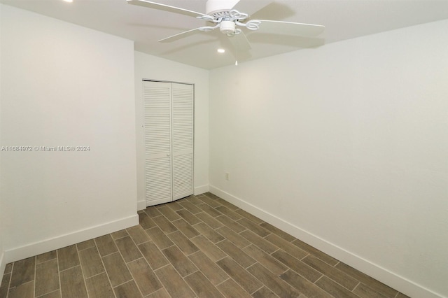 empty room featuring dark hardwood / wood-style floors and ceiling fan