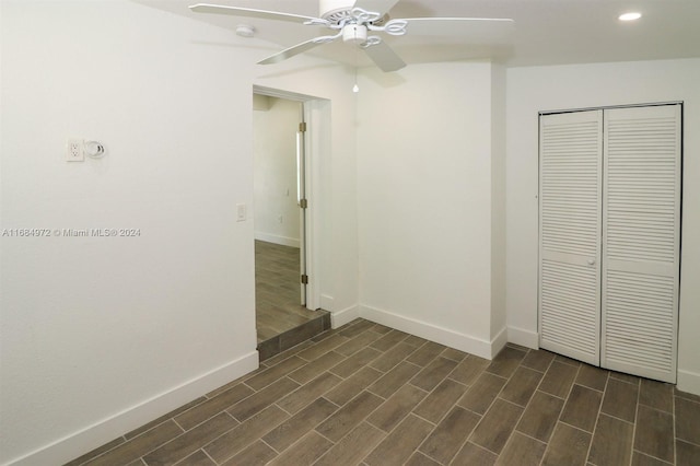 interior space with ceiling fan and dark wood-type flooring