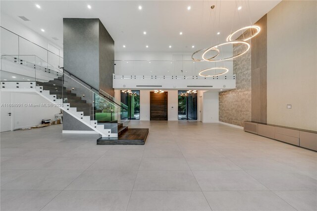 6695 SW 112th St, Pinecrest, FL 33156 - community lobby with a towering ceiling, stairs, and recessed lighting
