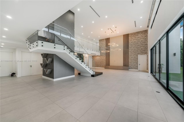 6695 SW 112th St, Pinecrest, FL 33156 - community lobby featuring stairs, a towering ceiling, and recessed lighting