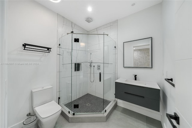 bathroom featuring vanity, an enclosed shower, and toilet