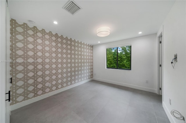 6695 SW 112th St, Pinecrest, FL 33156 - unfurnished room with wallpapered walls, baseboards, recessed lighting, and an accent wall