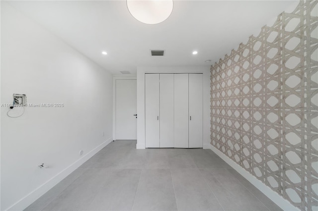 6695 SW 112th St, Pinecrest, FL 33156 - unfurnished bedroom with baseboards, recessed lighting, a closet, and tile patterned floors
