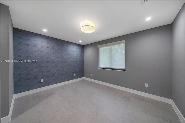 6695 SW 112th St, Pinecrest, FL 33156 - empty room featuring an accent wall, wallpapered walls, baseboards, and recessed lighting