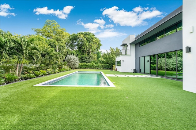 6695 SW 112th St, Pinecrest, FL 33156 - swimming pool with a lawn and a patio area