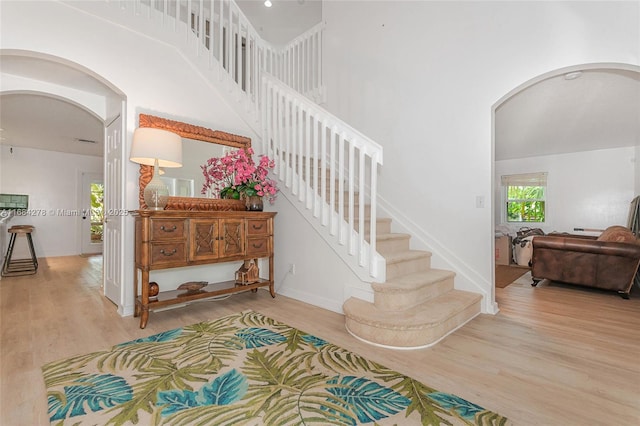 stairs with hardwood / wood-style flooring