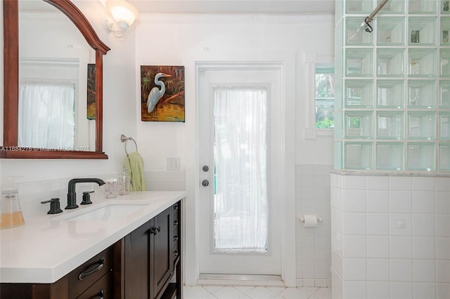 bathroom featuring vanity and ornamental molding