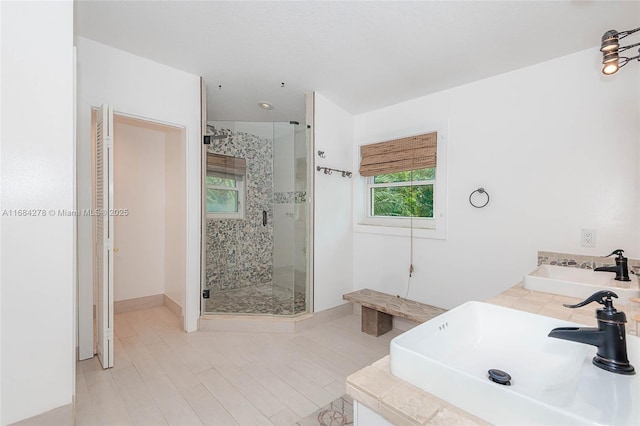 bathroom with vanity and an enclosed shower