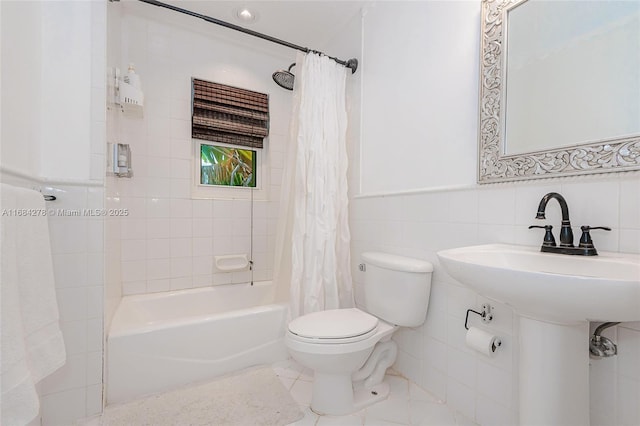 bathroom featuring tile walls, toilet, shower / tub combo, and tile patterned flooring