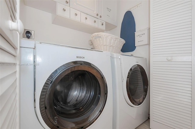 washroom with washer and dryer