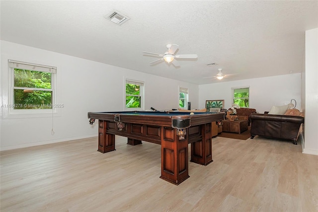 game room featuring light hardwood / wood-style floors, a textured ceiling, pool table, and ceiling fan