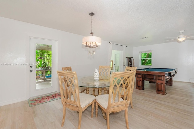 dining area with ceiling fan, pool table, a textured ceiling, and light hardwood / wood-style flooring