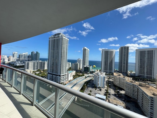 balcony featuring a water view